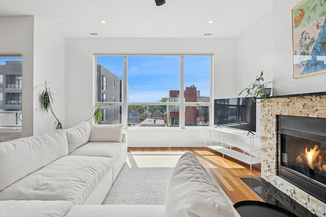 1719 N Western Ave Unit 4, Chicago, IL 60647 - living area featuring wood finished floors, a fireplace, and recessed lighting