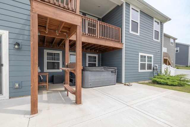738 Kentshire Cir, Elgin, IL 60124 - back of house featuring a hot tub, a patio, and a balcony