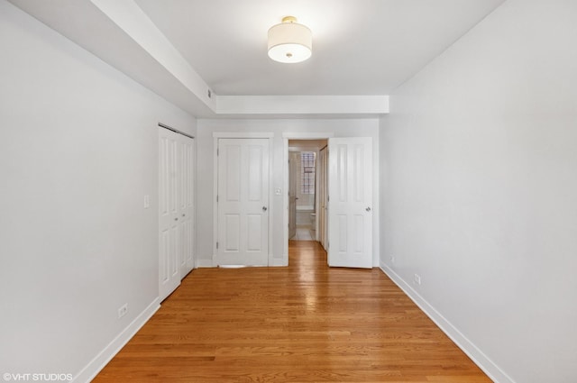 2305 N Kimball Ave Unit 1, Chicago, IL 60647 - unfurnished bedroom with light wood-style flooring and a closet