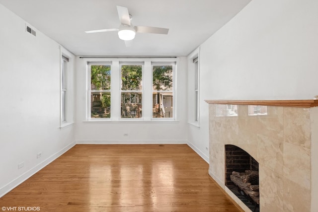 2305 N Kimball Ave Unit 1, Chicago, IL 60647 - unfurnished living room featuring wood finished floors, a fireplace, and a ceiling fan