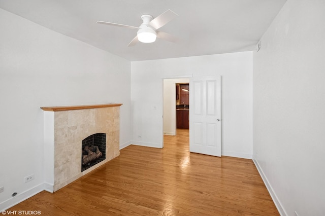 2305 N Kimball Ave Unit 1, Chicago, IL 60647 - unfurnished living room featuring a fireplace, wood finished floors, and ceiling fan