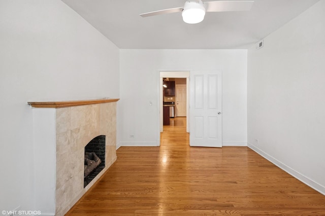 2305 N Kimball Ave Unit 1, Chicago, IL 60647 - unfurnished living room with wood finished floors, a fireplace, and ceiling fan