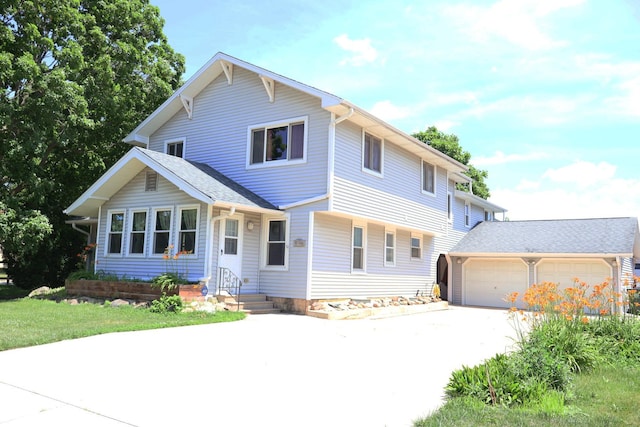 206 Washington St, Oswego, IL 60543 - traditional home with driveway and an attached garage