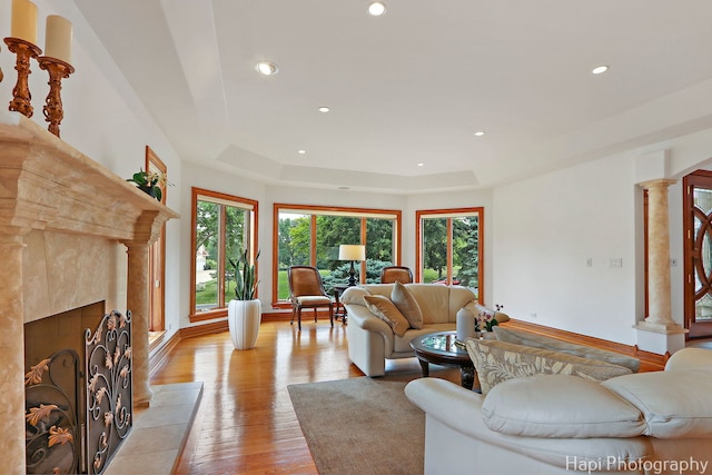 39 Forest Ln, South Barrington, IL 60010 - living area featuring plenty of natural light, a tile fireplace, recessed lighting, light wood-style flooring, and decorative columns