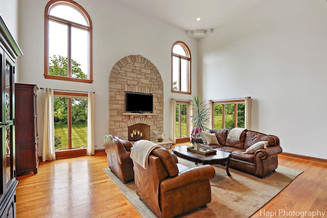 39 Forest Ln, South Barrington, IL 60010 - living area with a stone fireplace, a high ceiling, and light wood finished floors
