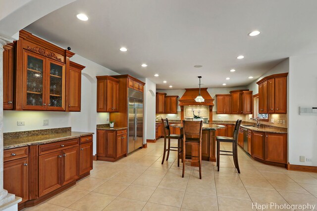 39 Forest Ln, South Barrington, IL 60010 - kitchen featuring stainless steel built in refrigerator, premium range hood, recessed lighting, and brown cabinetry