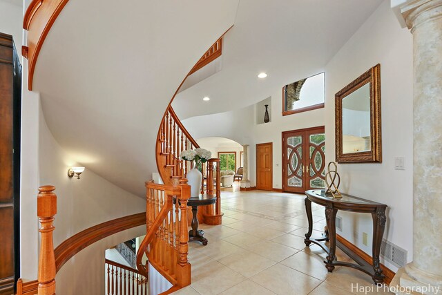 39 Forest Ln, South Barrington, IL 60010 - foyer entrance featuring arched walkways, ornate columns, recessed lighting, french doors, and stairway
