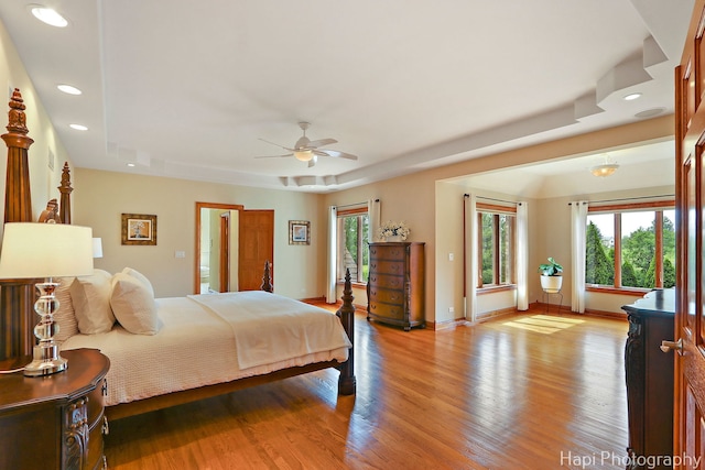 39 Forest Ln, South Barrington, IL 60010 - bedroom featuring recessed lighting, a tray ceiling, wood finished floors, and a ceiling fan