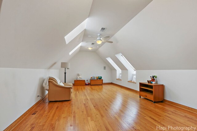 39 Forest Ln, South Barrington, IL 60010 - sitting room featuring a skylight, light wood-style flooring, vaulted ceiling, and ceiling fan