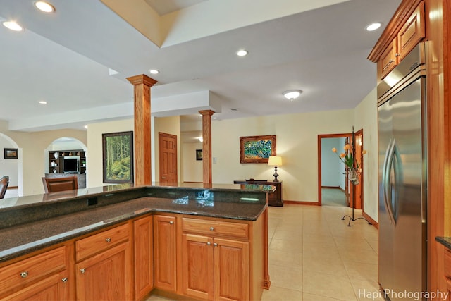 39 Forest Ln, South Barrington, IL 60010 - kitchen featuring stainless steel built in fridge, decorative columns, recessed lighting, arched walkways, and light tile patterned flooring