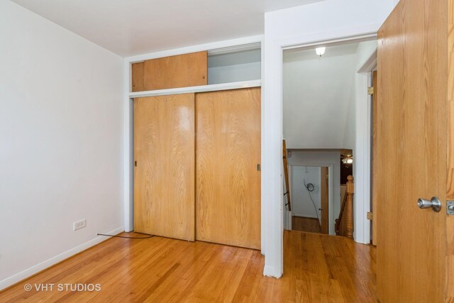 4912 W 32nd St, Cicero, IL 60804 - unfurnished bedroom featuring wood finished floors and a closet