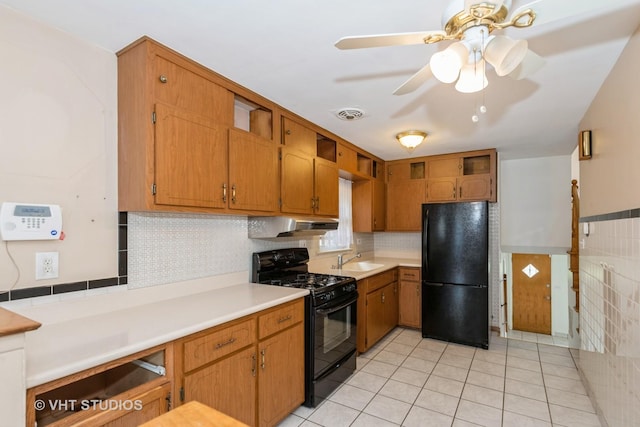 4912 W 32nd St, Cicero, IL 60804 - kitchen featuring black appliances, extractor fan, light tile patterned floors, light countertops, and ceiling fan