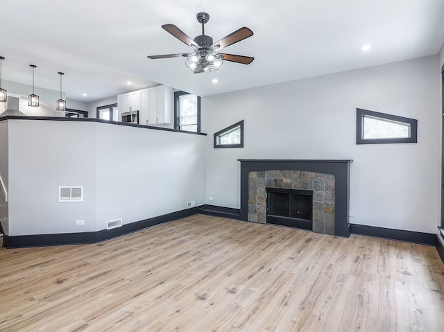 246 S Oak St, Itasca, IL 60143 - unfurnished living room featuring ceiling fan, light wood-type flooring, a fireplace, and recessed lighting