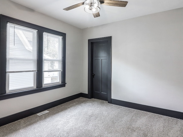 246 S Oak St, Itasca, IL 60143 - carpeted spare room with baseboards and a ceiling fan