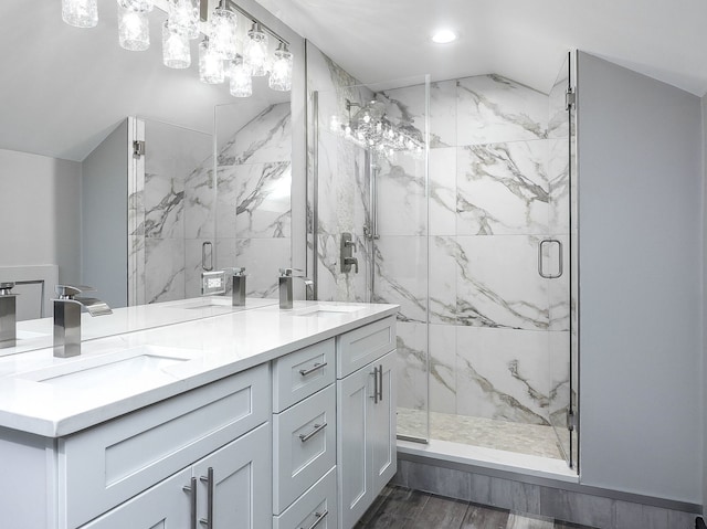 246 S Oak St, Itasca, IL 60143 - bathroom with double vanity, a marble finish shower, lofted ceiling, recessed lighting, and wood finished floors