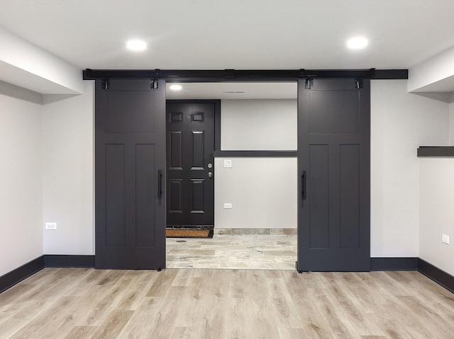 246 S Oak St, Itasca, IL 60143 - interior space featuring a barn door, wood finished floors, and recessed lighting