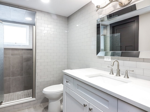 246 S Oak St, Itasca, IL 60143 - bathroom with tile walls, vanity, a shower stall, and tile patterned floors