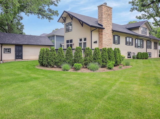 246 S Oak St, Itasca, IL 60143 - view of home's exterior with a chimney, a lawn, and roof with shingles
