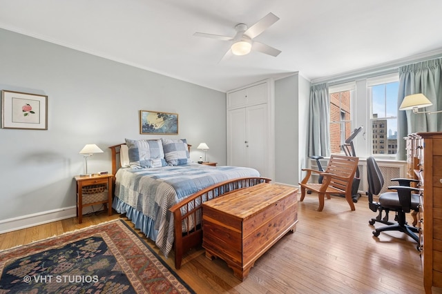 2440 N Lakeview Ave Unit 14E, Chicago, IL 60614 - bedroom with ornamental molding, wood-type flooring, and a ceiling fan