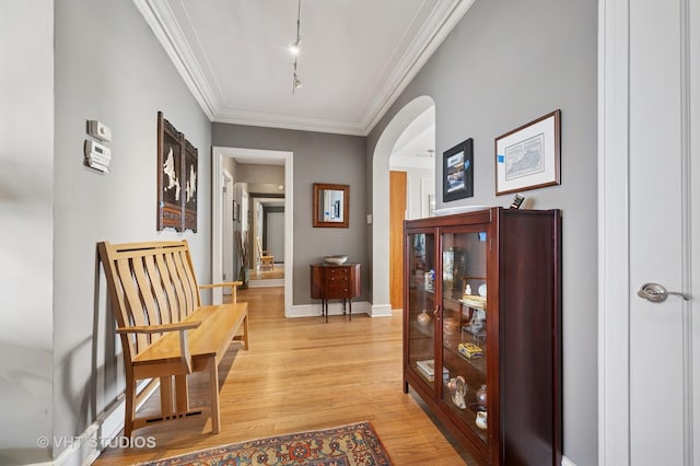 2440 N Lakeview Ave Unit 14E, Chicago, IL 60614 - corridor featuring arched walkways, light wood-type flooring, and ornamental molding