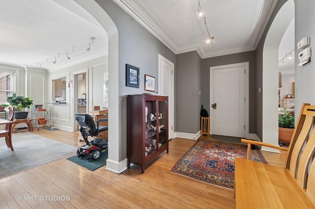 2440 N Lakeview Ave Unit 14E, Chicago, IL 60614 - entrance foyer with track lighting, arched walkways, light wood-style flooring, and crown molding
