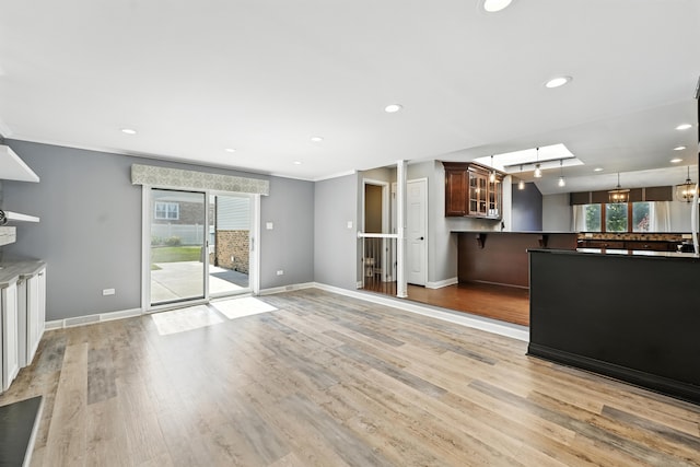 12449 W Prairie Dr, Homer Glen, IL 60491 - unfurnished living room with light wood-style flooring, recessed lighting, a chandelier, and crown molding