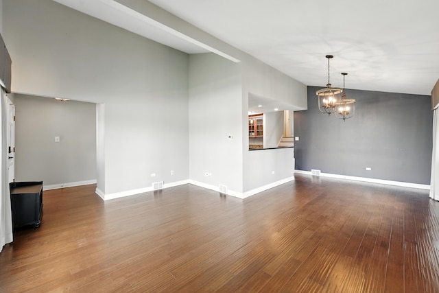 12449 W Prairie Dr, Homer Glen, IL 60491 - unfurnished living room featuring lofted ceiling, a chandelier, dark wood-style flooring, and stairs