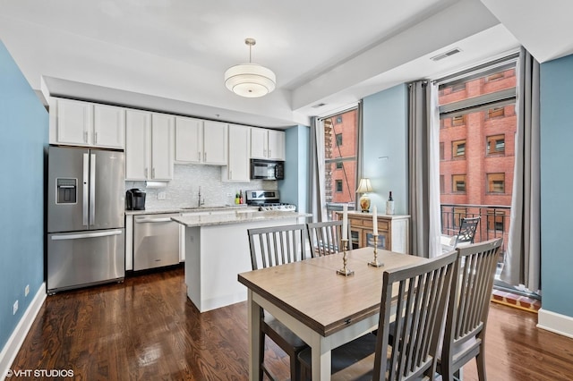 165 N Canal St Unit 726, Chicago, IL 60606 - dining area featuring dark wood-style flooring and baseboards