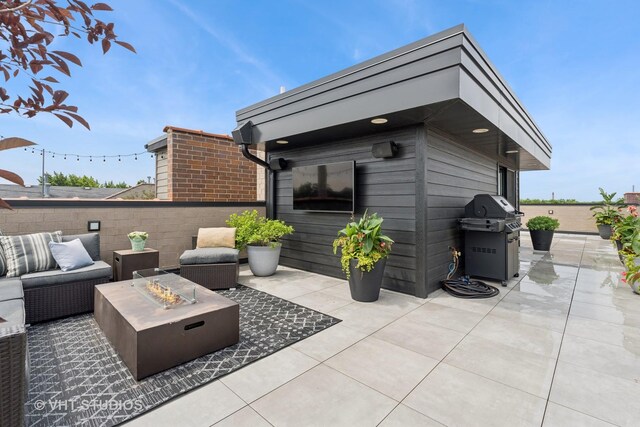 2724 N Wayne Ave Unit 3, Chicago, IL 60614 - view of patio featuring a grill and an outdoor fire pit