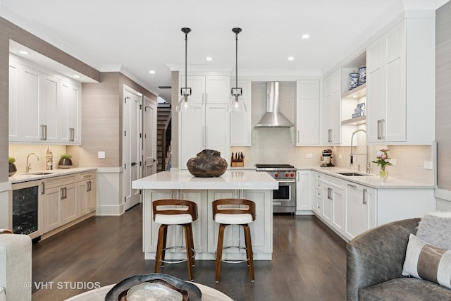 2724 N Wayne Ave Unit 3, Chicago, IL 60614 - kitchen featuring wall chimney exhaust hood, premium range, beverage cooler, dark wood finished floors, and recessed lighting