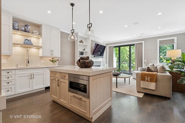 2724 N Wayne Ave Unit 3, Chicago, IL 60614 - kitchen with open floor plan, dark wood-style flooring, open shelves, light countertops, and recessed lighting
