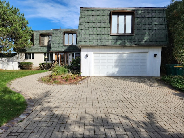 501 Kingston Blvd, Mchenry, IL 60050 - view of front property with mansard roof, decorative driveway, a front lawn, and an attached garage