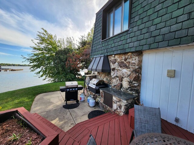 501 Kingston Blvd, Mchenry, IL 60050 - back of property with a sunroom, a deck, a lawn, a patio, and mansard roof