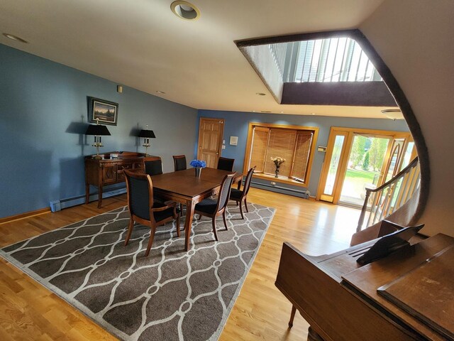 501 Kingston Blvd, Mchenry, IL 60050 - dining space featuring stairway, wood finished floors, a baseboard radiator, and recessed lighting