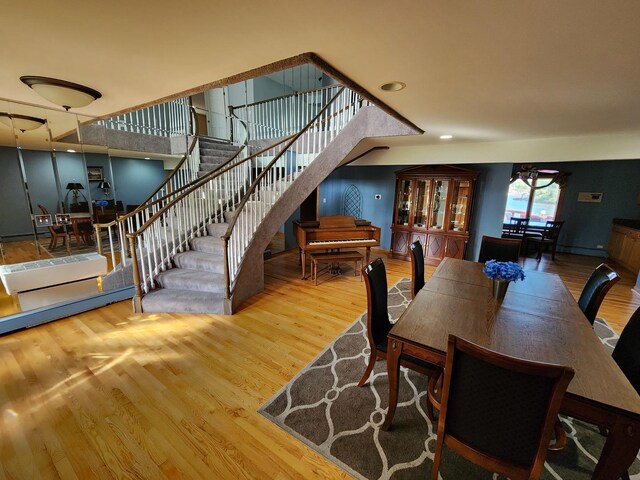 501 Kingston Blvd, Mchenry, IL 60050 - dining area with light wood-style floors, a ceiling fan, and baseboard heating