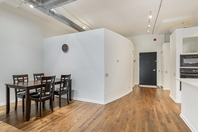 130 S Canal St Unit 624, Chicago, IL 60606 - dining space with track lighting and wood finished floors