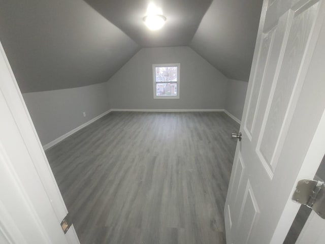 956 2nd Ave, Aurora, IL 60505 - additional living space with wood finished floors and vaulted ceiling