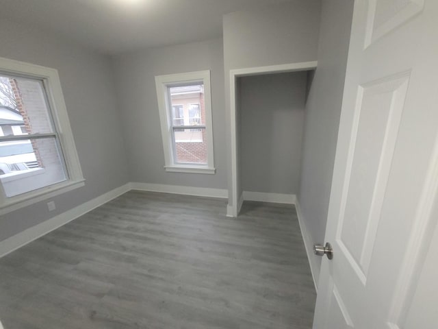 956 2nd Ave, Aurora, IL 60505 - unfurnished bedroom featuring wood finished floors and baseboards