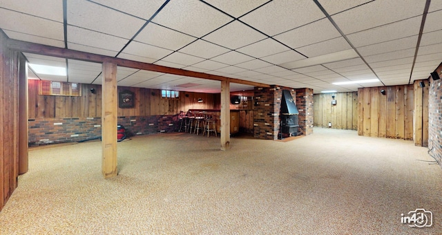 74 Wilmette Dr, Oswego, IL 60543 - finished basement with a drop ceiling, carpet flooring, wood walls, and a bar