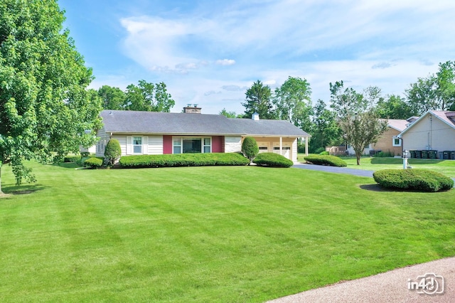 74 Wilmette Dr, Oswego, IL 60543 - ranch-style house with asphalt driveway, a front yard, and a chimney