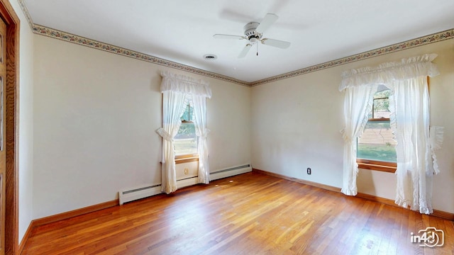 74 Wilmette Dr, Oswego, IL 60543 - unfurnished room featuring light wood-type flooring, a ceiling fan, and a baseboard radiator