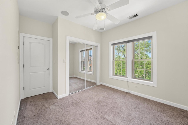 837 E 52nd St Unit 3, Chicago, IL 60615 - unfurnished bedroom with carpet, a closet, and ceiling fan
