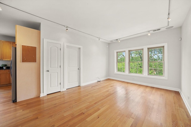 837 E 52nd St Unit 3, Chicago, IL 60615 - empty room with track lighting and light wood-style flooring