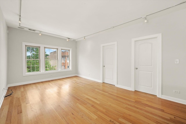 837 E 52nd St Unit 3, Chicago, IL 60615 - spare room with track lighting and light wood-type flooring