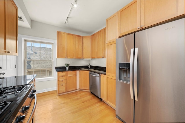 837 E 52nd St Unit 3, Chicago, IL 60615 - kitchen with stainless steel appliances, light wood-style flooring, light brown cabinets, and track lighting