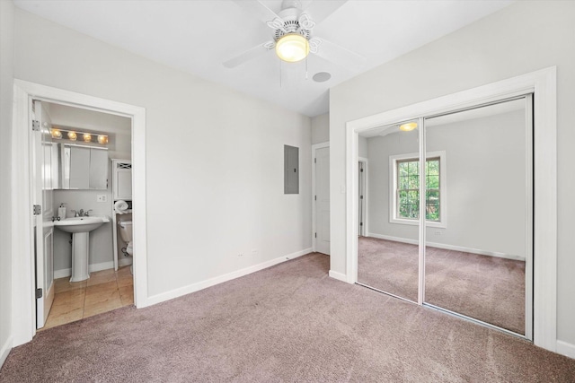 837 E 52nd St Unit 3, Chicago, IL 60615 - unfurnished bedroom with carpet flooring, electric panel, a closet, ensuite bath, and ceiling fan