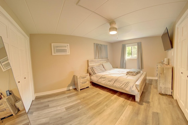 3959 W 104th St Unit 1-A, Chicago, IL 60655 - bedroom with light wood finished floors, a wall mounted AC, ceiling fan, and a closet