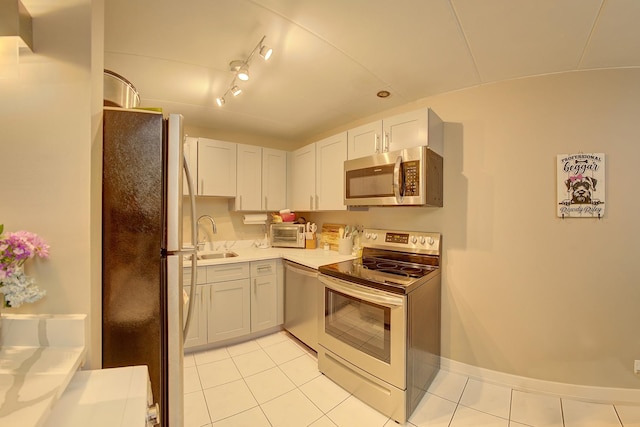 3959 W 104th St Unit 1-A, Chicago, IL 60655 - kitchen featuring appliances with stainless steel finishes, light tile patterned floors, and light countertops