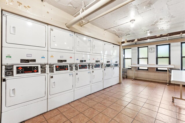 3410 N Lake Shore Dr Unit 5E, Chicago, IL 60657 - community laundry featuring stacked washer / drying machine, light tile patterned floors, and washing machine and clothes dryer