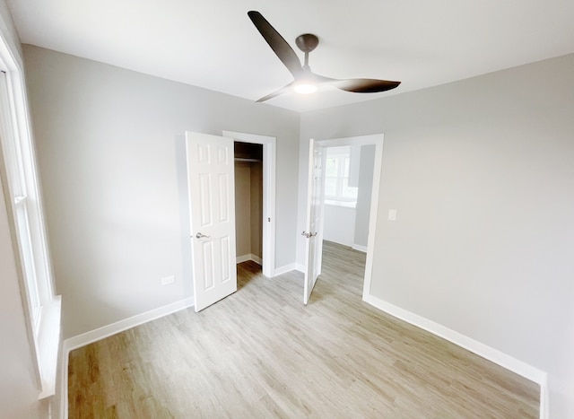1509 Saint Charles Rd, Maywood, IL 60153 - unfurnished bedroom with light wood-style floors, a closet, and ceiling fan